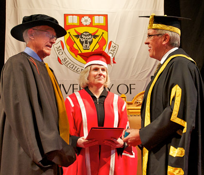 Dr. Ole Nielsen (left) receives the Order of the University of Calgary. Photo: Dave Brown, University of Calgary.