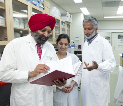 Left to right: Dr. Baljit Singh, the WCVM's associate dean of research; MSc student Dhingra Harpreet; and WCVM virologist Dr. Vikram Misra. Photo: David Stobbe.