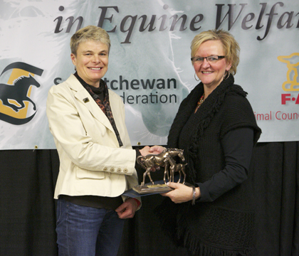 FACS executive director Adele Buettner (right) presents the Award of Distinction (Equine Welfare Communication) to WCVM veterinarian Dr. Sue Ashburner. Photos: Myrna MacDonald.