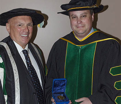 Dr. Matthew Links (right) and U of S President Dr. Gordon Barnhart (left) at the convocation ceremony.Photo Credit: Dr. Graham Links