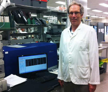 Dr. Barry Blakley alongside the analytical equipment that's used to measure ergot concentrations. Photos: Alex Neumann.