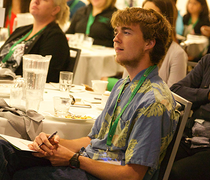 A student takes in a presentation at the One Health Leadership Experience. Photo by Myrna MacDonald.
