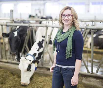 Janna Moats' research examines how the nutritional value of milk is affected when dairy cows are fed a supplemented flaxseed diet. Photo by David Stobbe