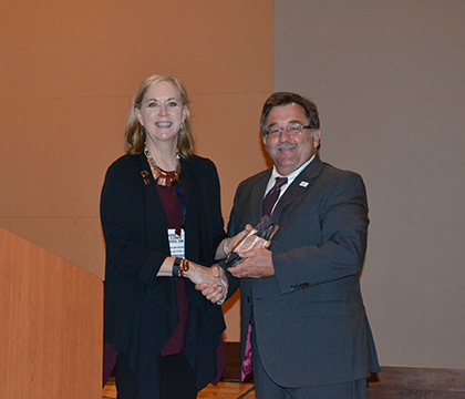 President Freeman recognizes immediate past president Dr. Eleanor Green of Texas A&M University for her service. Photo courtesy AAVMC. 