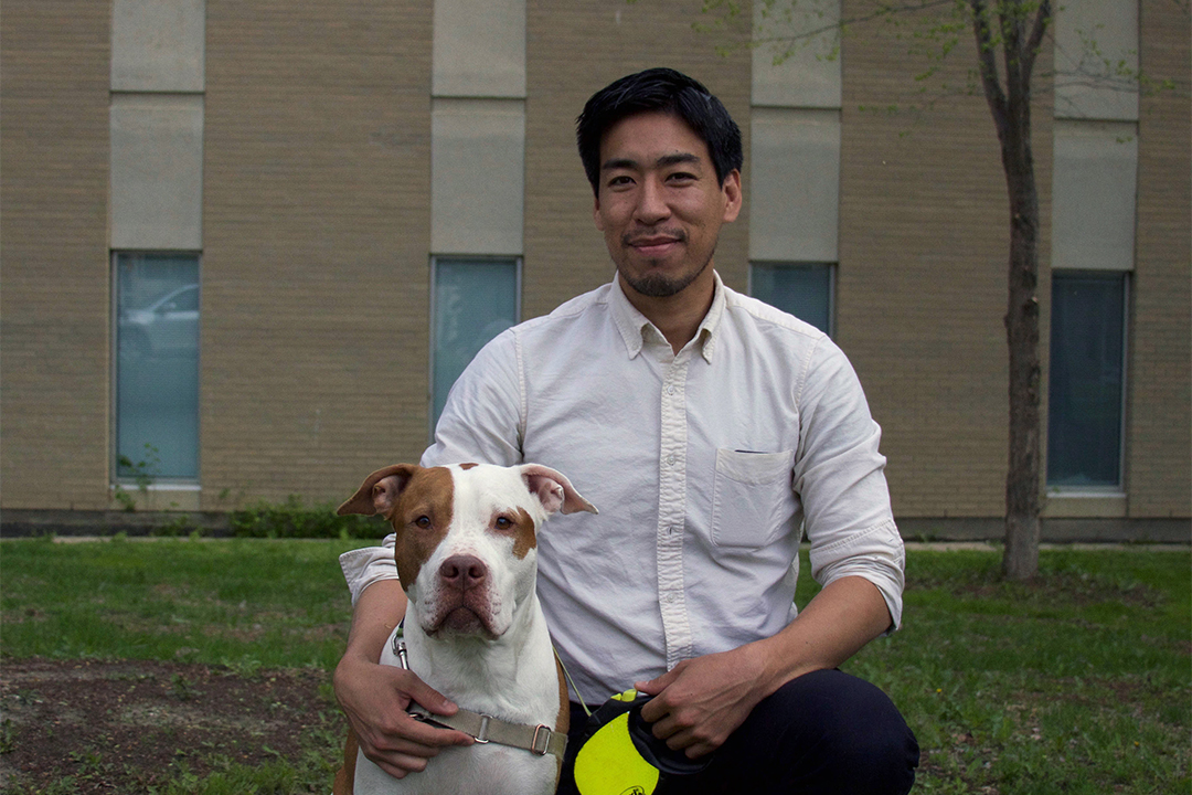 Dr. Koji Aoki with his dog Sam. Photo by WCVM Today.