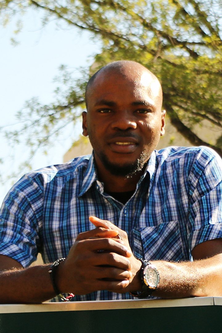 Moses Ikechukwu, getting some sun outside of the WCVM building. Photo by Harrison Brooks.