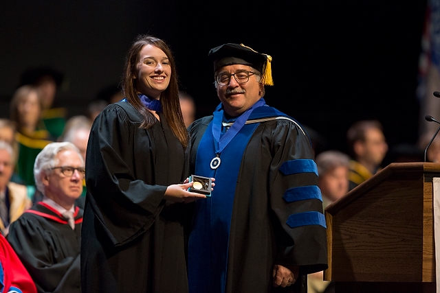 WCVM Dean Douglas Freeman presents the college's Faculty Gold Medal to Dr. Jessica Paravicini at the U of S Convocation on June 7.