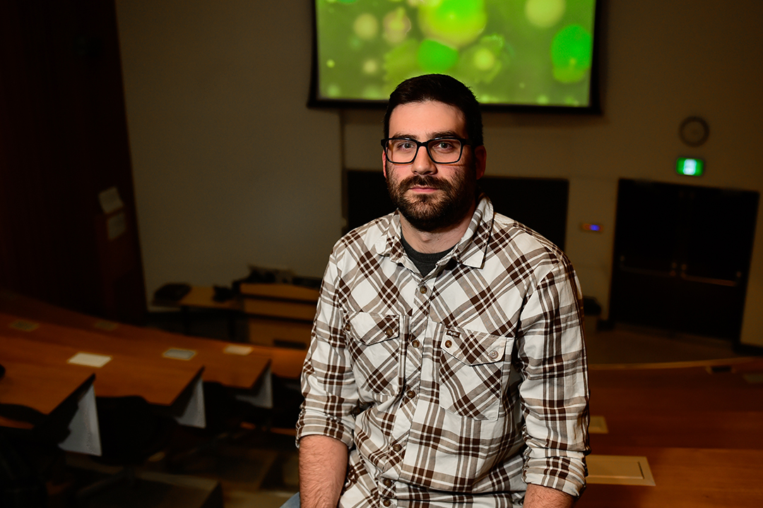 Dr. Tony Ruzzini, assistant professor, Dept. of Veterinary Microbiology, WCVM, is working on research to search for best behaviour in bacteria. Photo: Debra Marshall (on behalf of Saskatchewan Health Research Foundation)