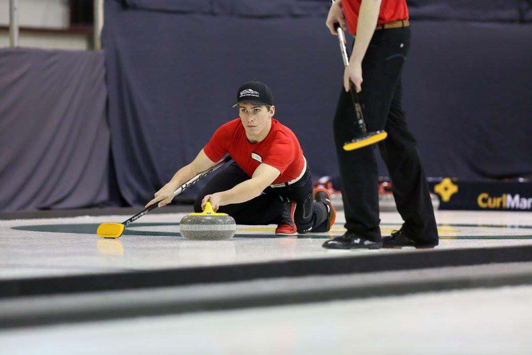 Vet student Beau Bridgeman takes aim during a competitive curling game with his Brandon-based team in Manitoba. Supplied photo. 