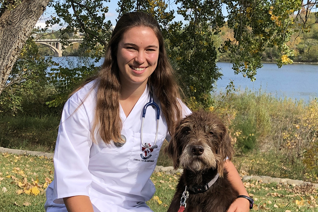 Emmalyn Elgersma with her dog Tukr after the WCVM's White Coat Ceremony on Sept. 20. Supplied photo.