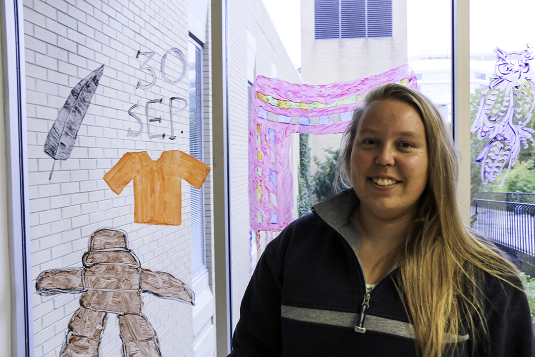 Rad was key in organizing a window painting activity in celebration of the 2019 Orange Shirt Day in late September. Photo: Jeanette Neufeld. 