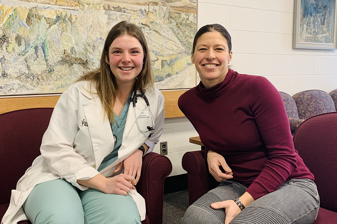 Dr. Keri Hudson-Reykdal visits with senior WCVM student Jenna Noordenbos, who spent several summers working with Hudson Reykdal in Ashern, Man. 