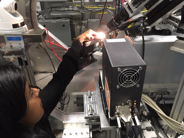 Research team member Shathi Akhter loads a sample on the VESPERS beamline. Photo: Canadian Light Source. 