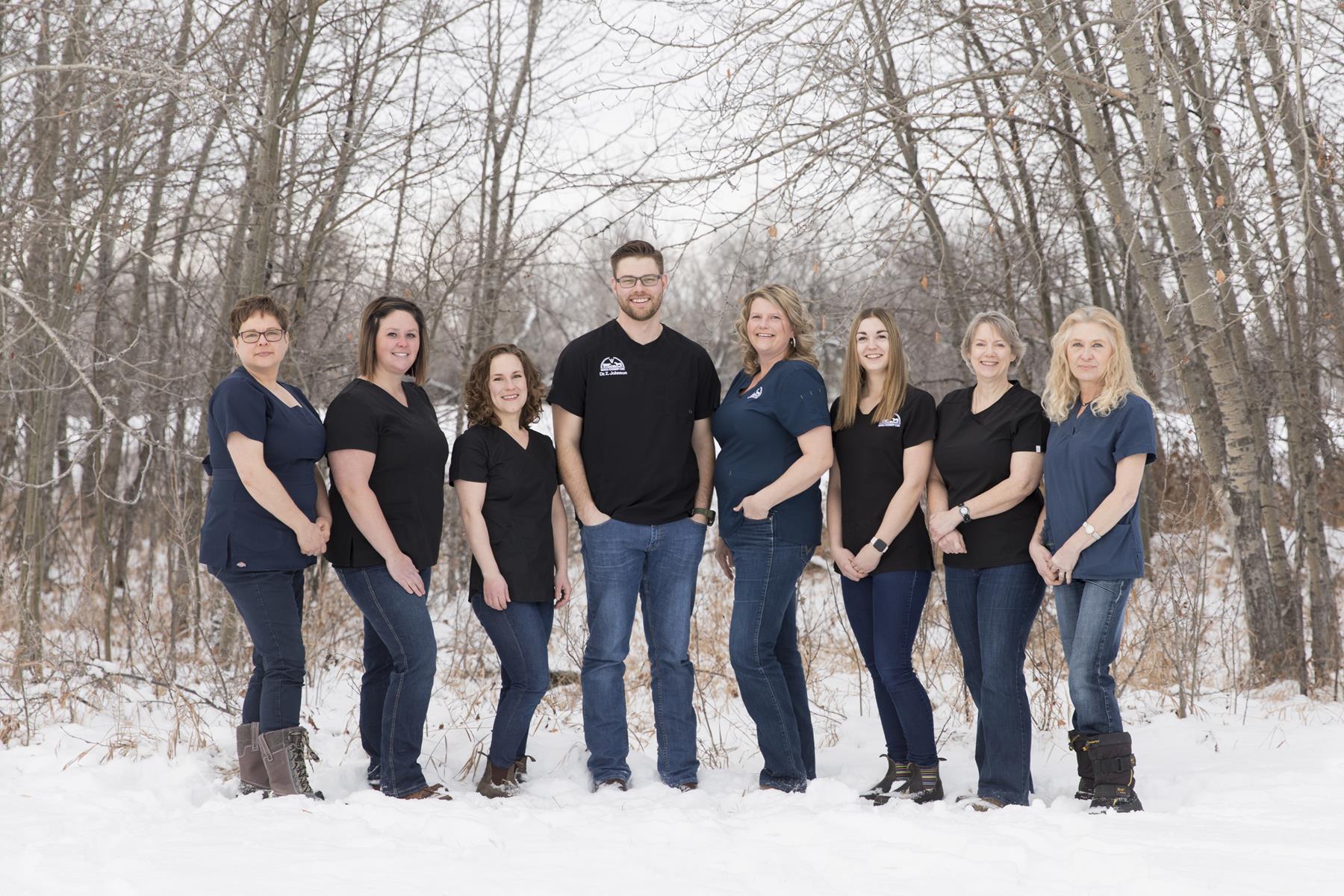 Dr. Zach Johnson (centre) and his wife Kylie (third from left) own the Melville Veterinary Clinic. Supplied photo. 