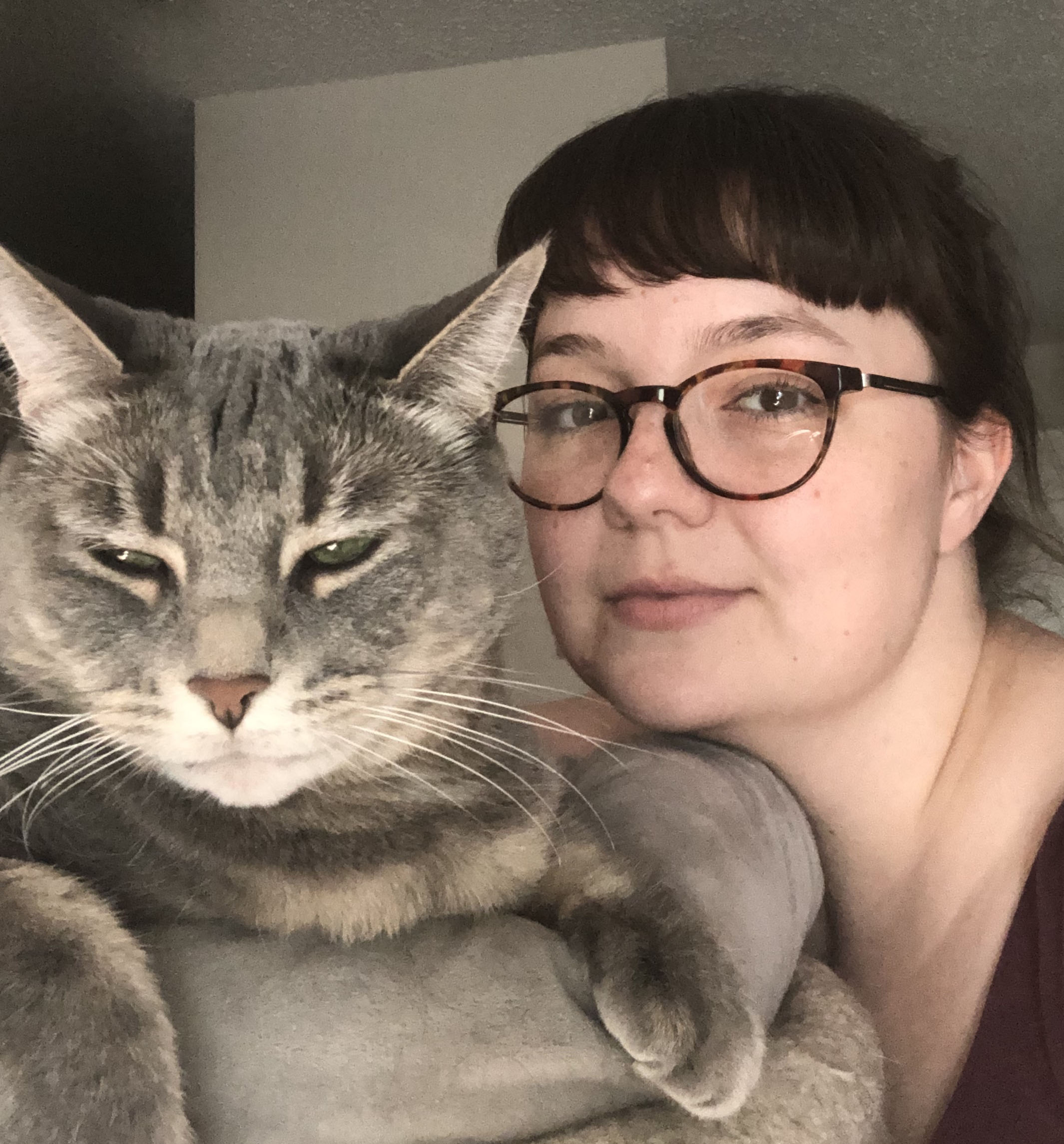 Veterinary student Chelsea Davidson and one of her feline companions. Photo: Chelsea Davidson. 