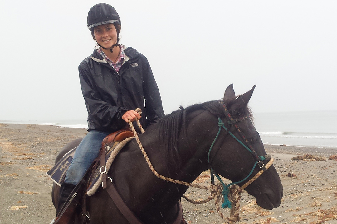 WCVM graduate Dr. Reina Fennell (DVM) and her horse Shadow on Haida Gwaii’s North Beach in B.C. Submitted photo.