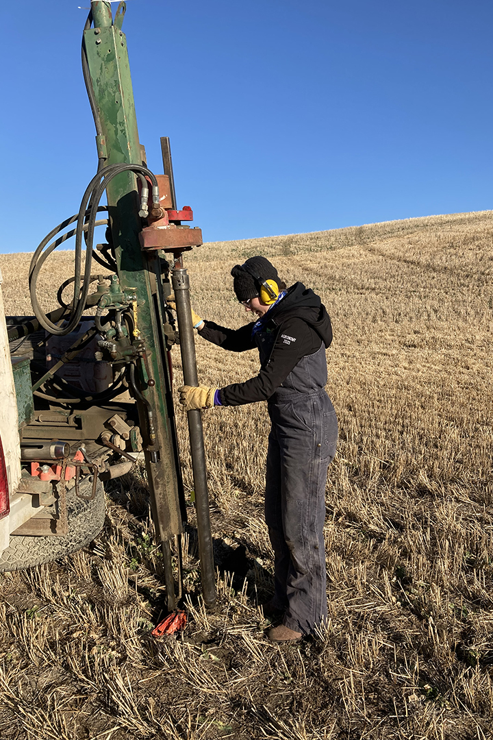 Graduate student Amanda Mitchell uses a truck-mounted soil sampling probe in an agricultural field. Supplied photo.