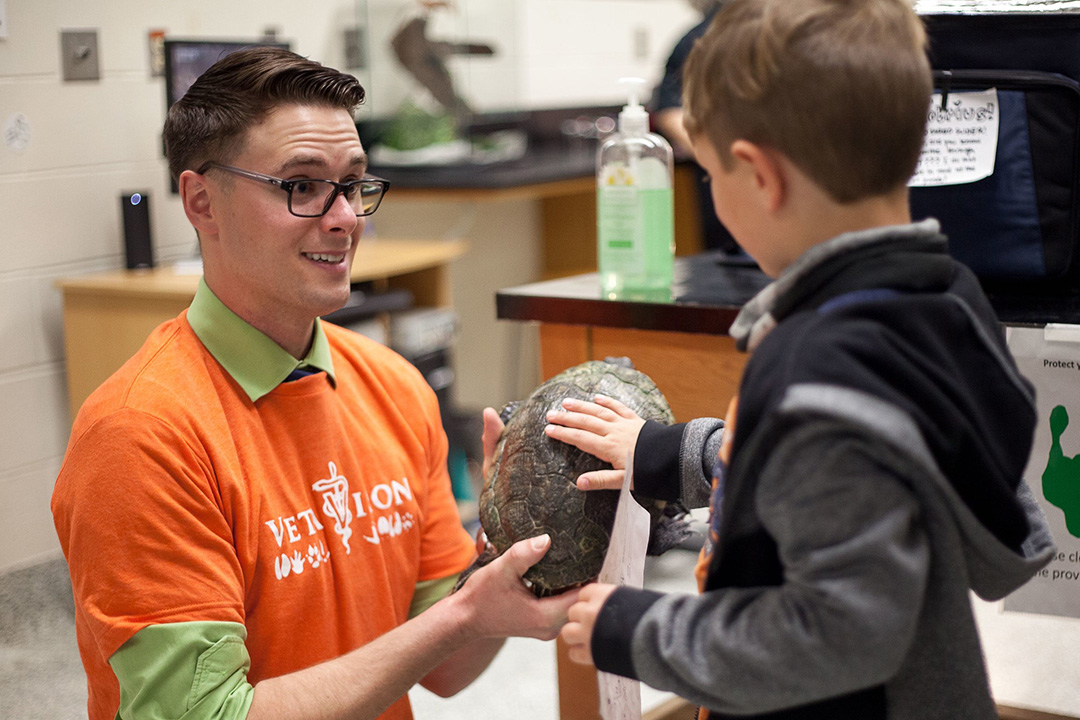 Veterinary student Andrew Crookes shows off a turtle during the 2019 Vetavision event at USask’s Western College of Veterinary Medicine. (Photo: Christina Weese)