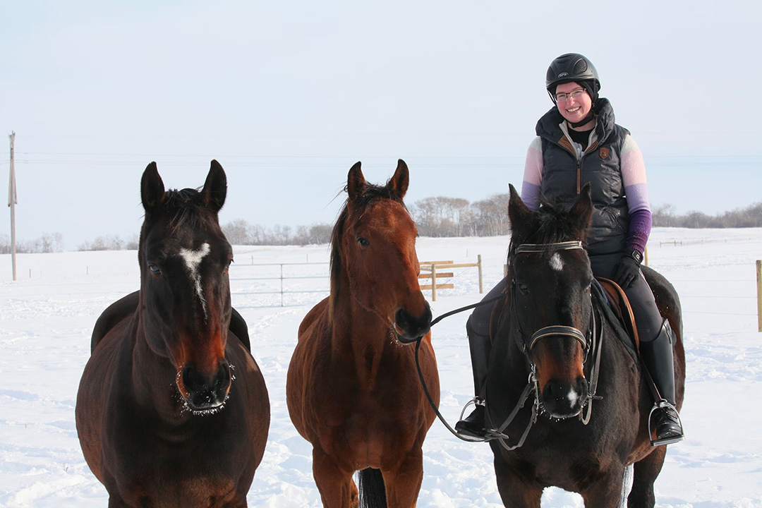 WCVM resident Dr. Madison Ricard with her three horses.