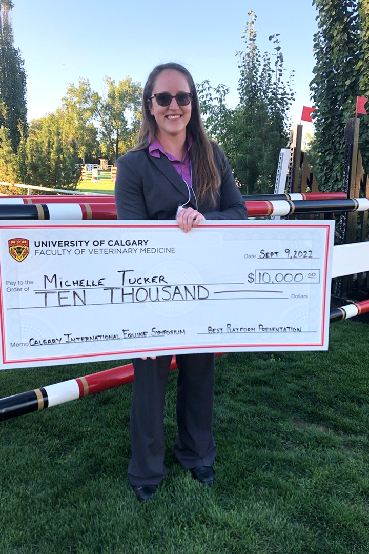 Dr. Michelle Tucker displays her $10,000 grand prize cheque. Submitted photo. 