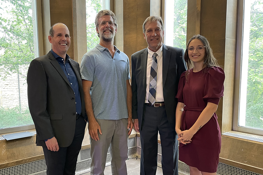 Left to right: Dr. Al Chicoine, Dr. Brent Bobick, Dr. Gregg Adams and Laura Zmud, who accepted Carolyn Cartwright's award on her mother's behalf at the USask Faculty and Staff Awards evening on June 14. Photo: Myrna MacDonald.