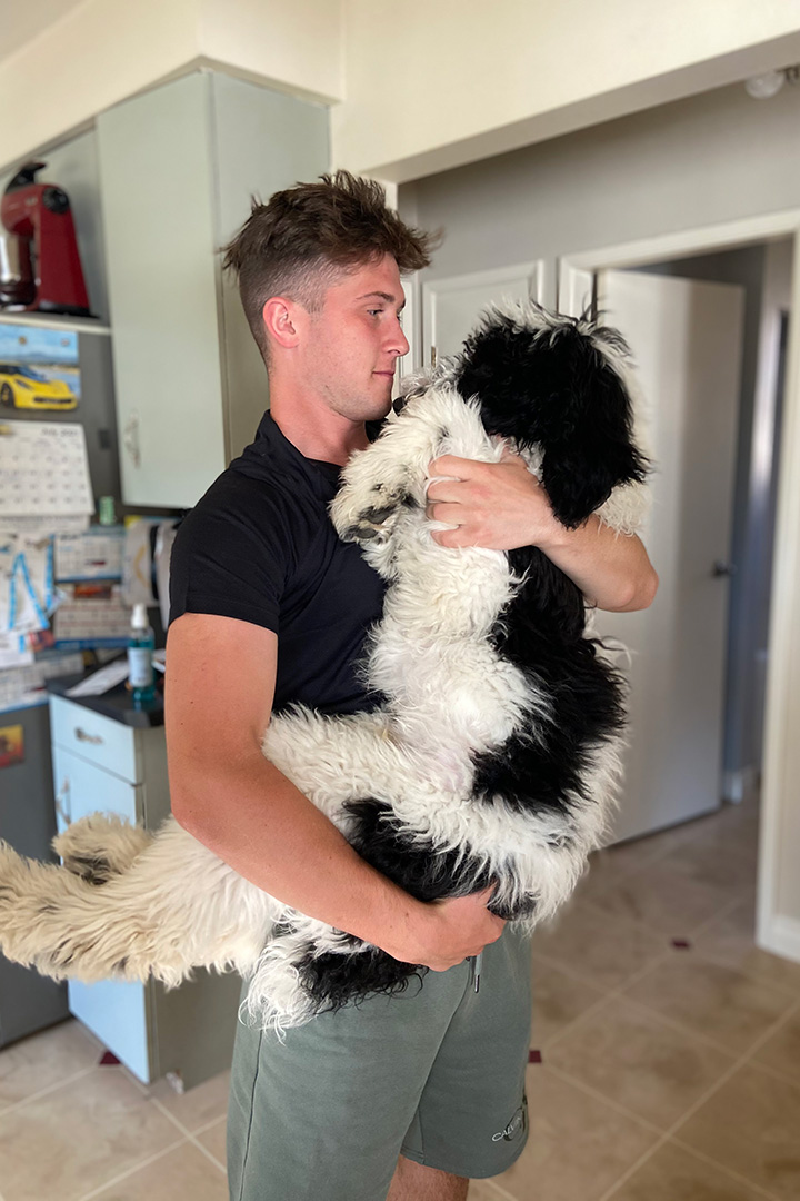 Joel Bilyk and Kevin, his family's sheepadoodle. Supplied photo. 