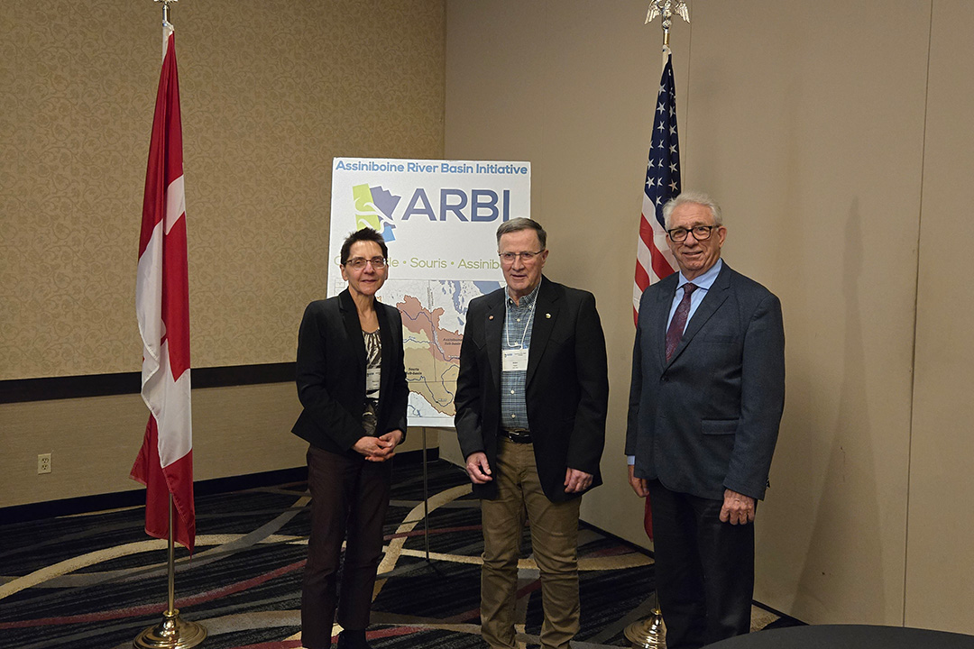 Dr. Allan Preston (centre) receives his Lifetime Achievement Award from Manitoba Beef Producers' board member Maureen Cousins (left) and MP Larry Maguire (right). Photo: Assiniboine River Basin Initiative