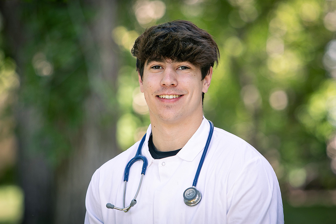 WCVM veterinary student Boden Marley in his white coat