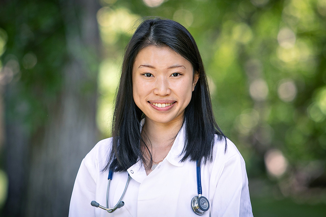 Veterinary student Ashley U in white coat