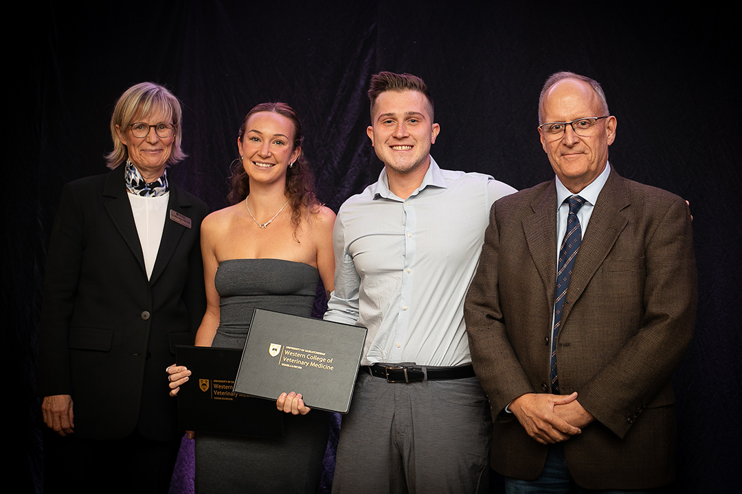 Left to right: Dr. Gillian Muir (WCVM dean), Kelsey Drinkall, Joel Billyk and Dr. Steve Manning, WCVM's associate dean of clinical programs. Photo: Christina Weese. 
