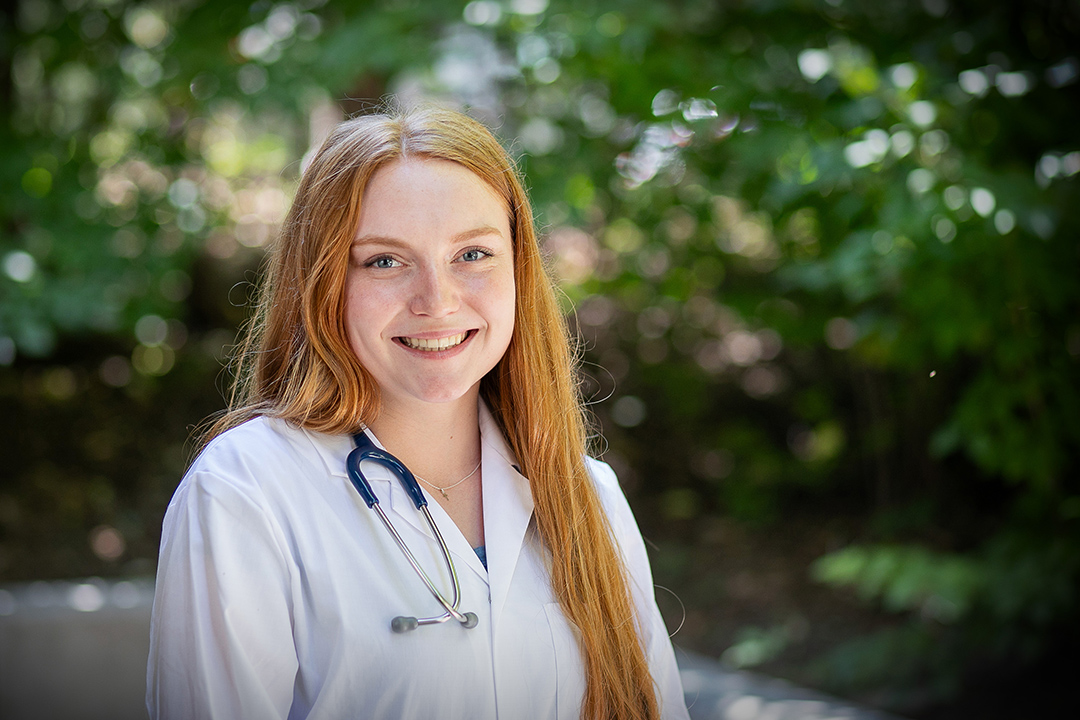 Veterinary student in white coat and stethosope.