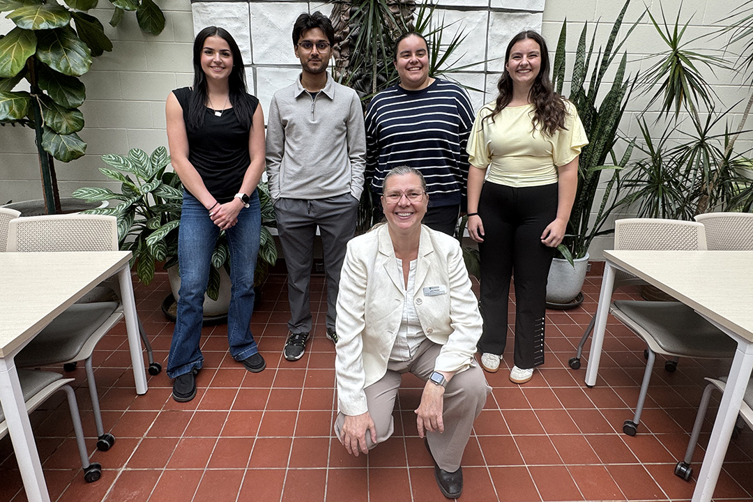 Left to right (back): Addisyn Lepp, Zahin Akhand, Yoana Reyes Morales and Elizabeth Rudderham. Front row: Dr. Lynn Weber, associate dean, research. Photo: Cat Zensl
